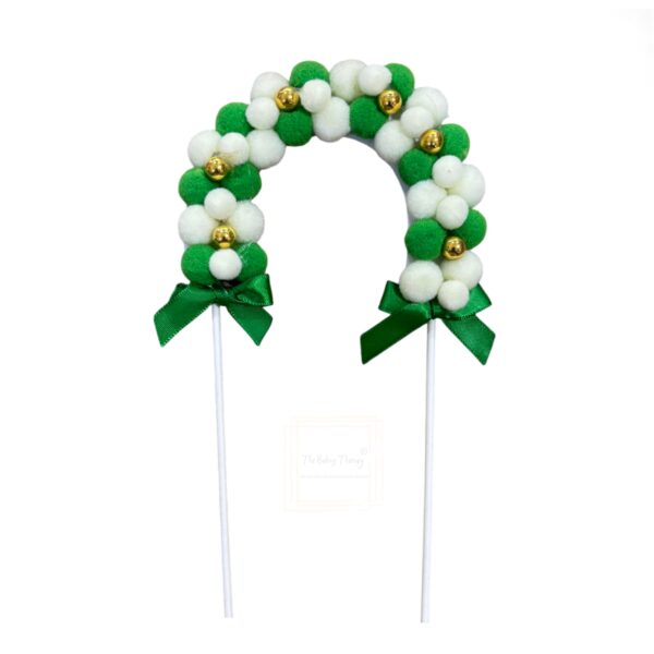 green-pom-pom-arch-with-gold-beads-cake-topper