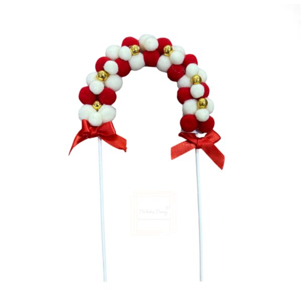 red-pom-pom-arch-with-gold-beads-cake-topper